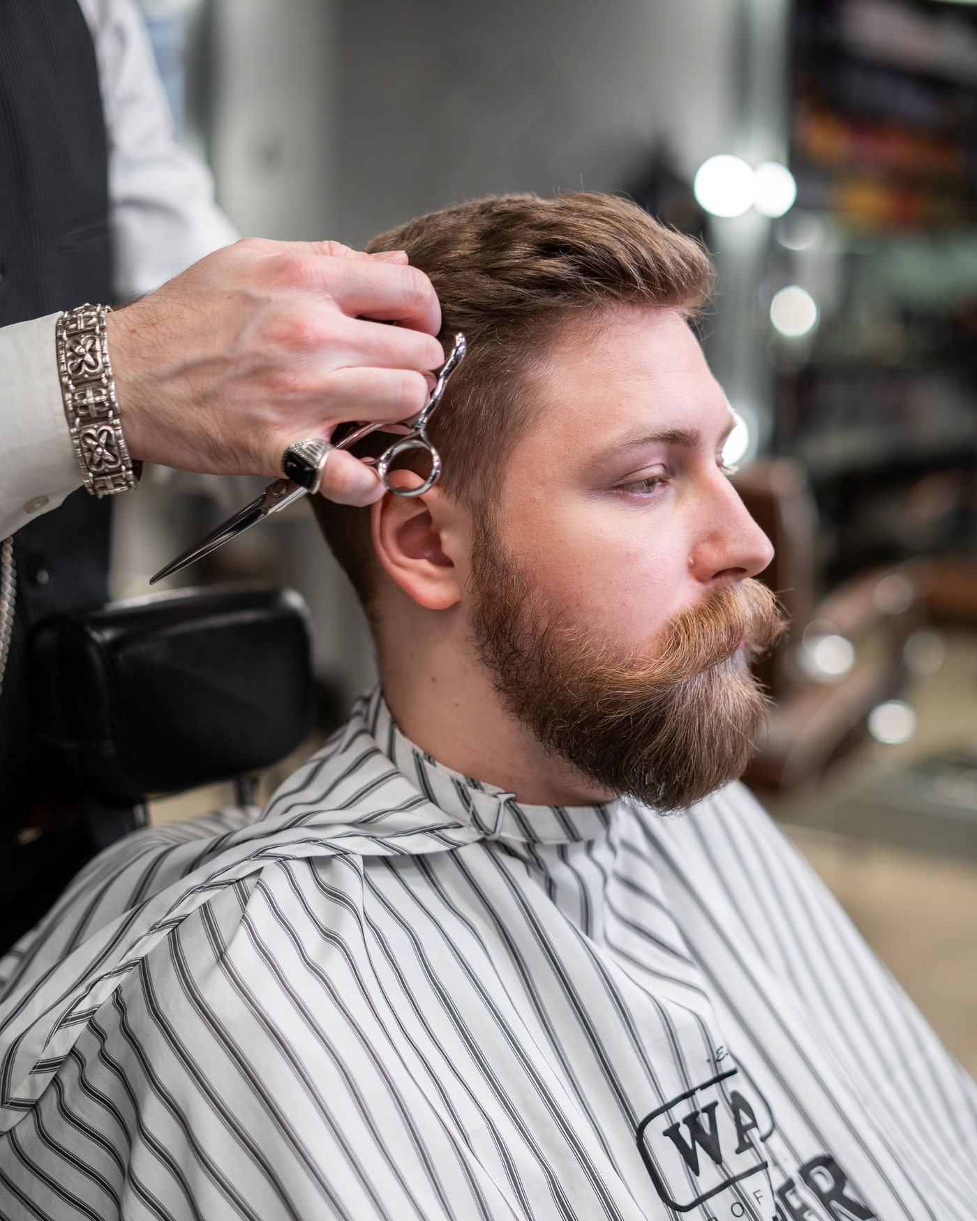 A client getting a scissor haircut